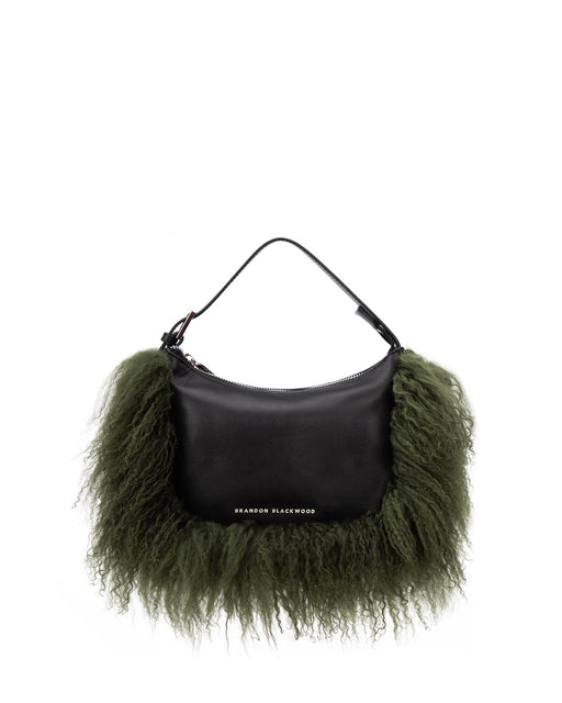 Front of Cortni Bag in black leather with bushy green mongolian wool trim with brandon blackwood logo hardware