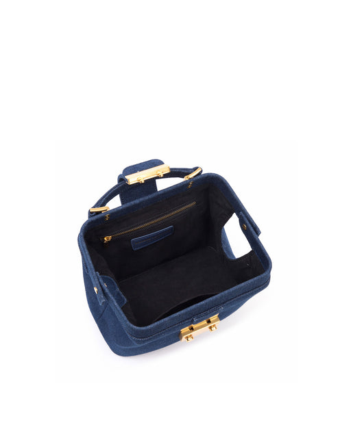 Angled close up of Elizabeth Doctor Bag in dark denim with brass clasp buckle with embossed logo