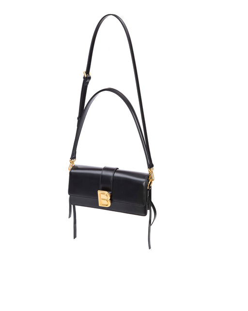 Nia Bag with black hard leather with black leather strap with brass logo magnetic closure hanging from strap