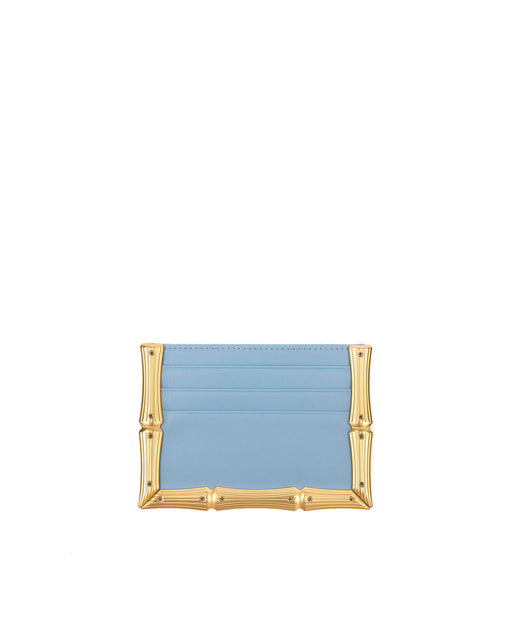 Back of Bamboo B Cardholder in powder blue leather with 6 card slots and brass bamboo embossed trim