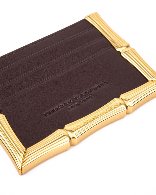 Angled close up of Bamboo B Cardholder in Dark Brown leather with 6 card slots and brass bamboo embossed trim