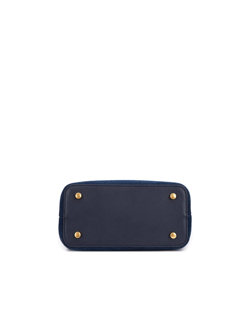 Bottom of Elizabeth Doctor Bag in dark denim four metal feet