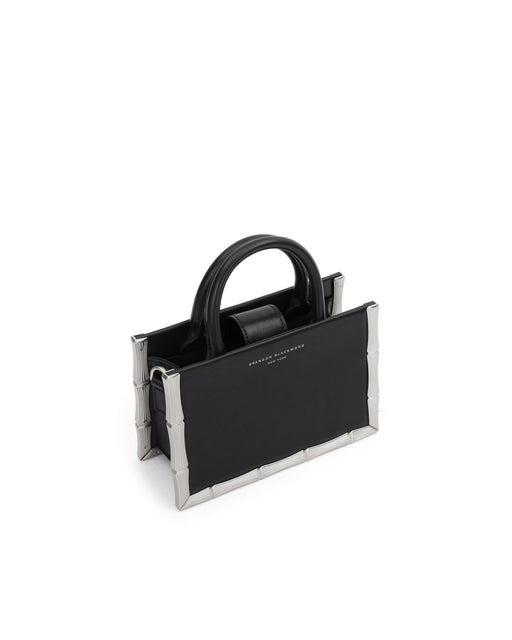 Angled close up Bamboo B Tote in black leather with leather handle and silver bamboo embossed trim