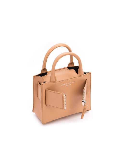 Angled over head view of wide open Kuei Bag in tan smooth leather with silver handle leather and silver zipper 
