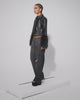 Model walking on treadmill wearing Micha Jacket Sheep Leather with real ostrich marble - hand stitched- feathers at cuff