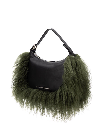 Angled over head view of Cortni Bag in black leather with bushy green mongolian wool  thumbnail 4