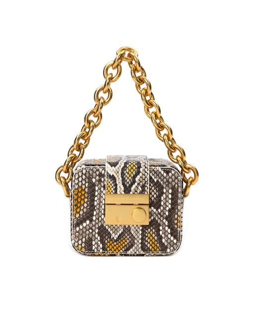Front of Caro Buckle Bag in yellow print python with brass chunky chain handle and brass clasp buckle 