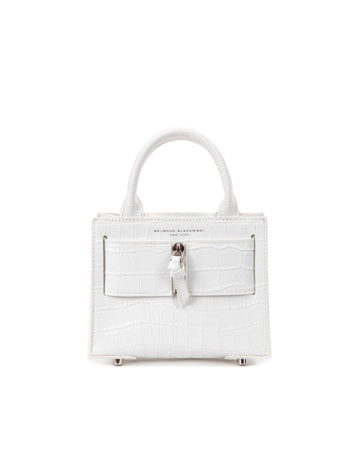Front of Kuei Bag in white croc embossed leather with white croc embossed silver zipper 