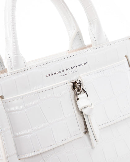 Angled close up of Kuei Bag in white croc embossed leather thumbnail 3