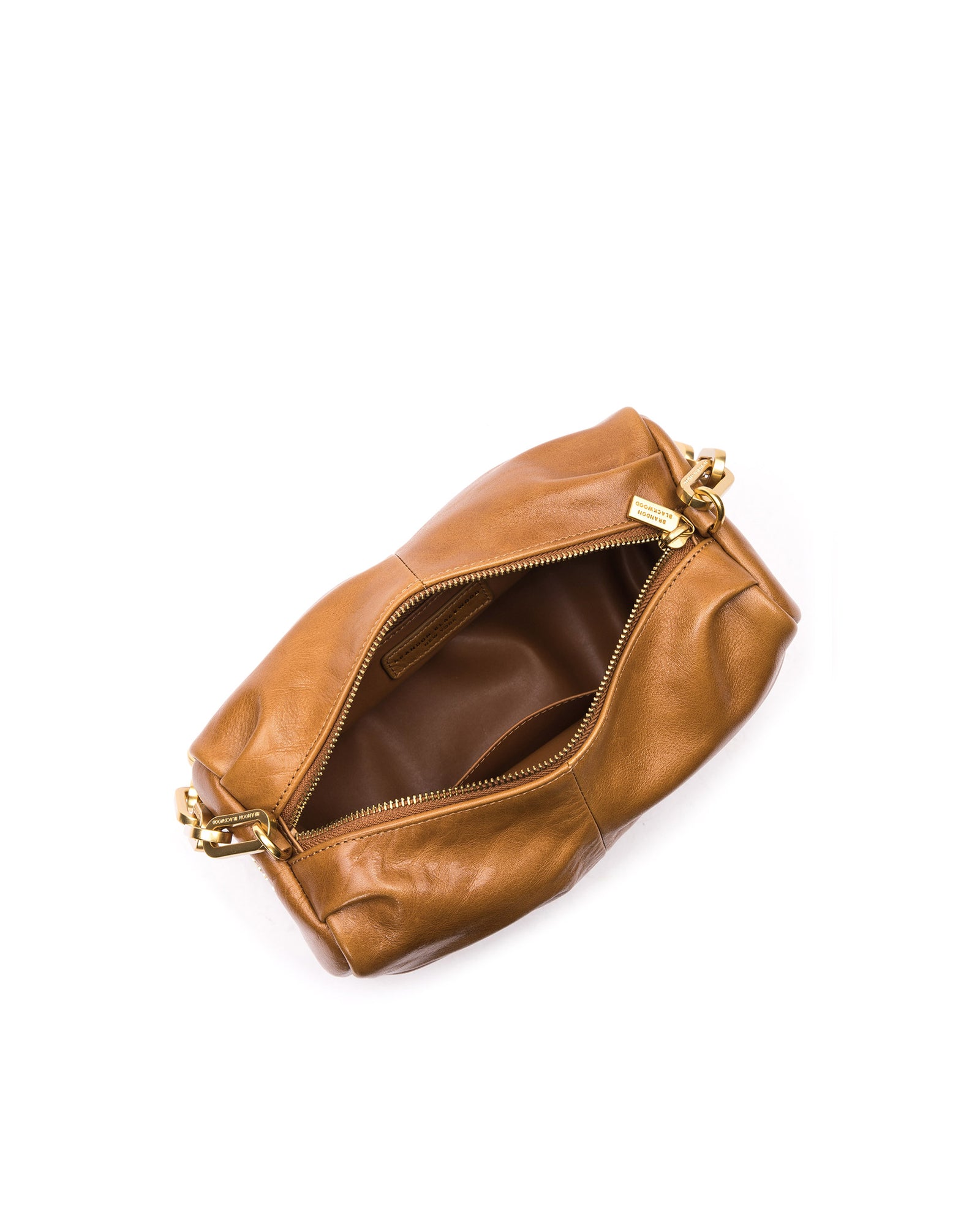 Angled over head view of Valentina Shoulder Bag in Tan Cracked Leather with Brass Chain Handle with open zipper
