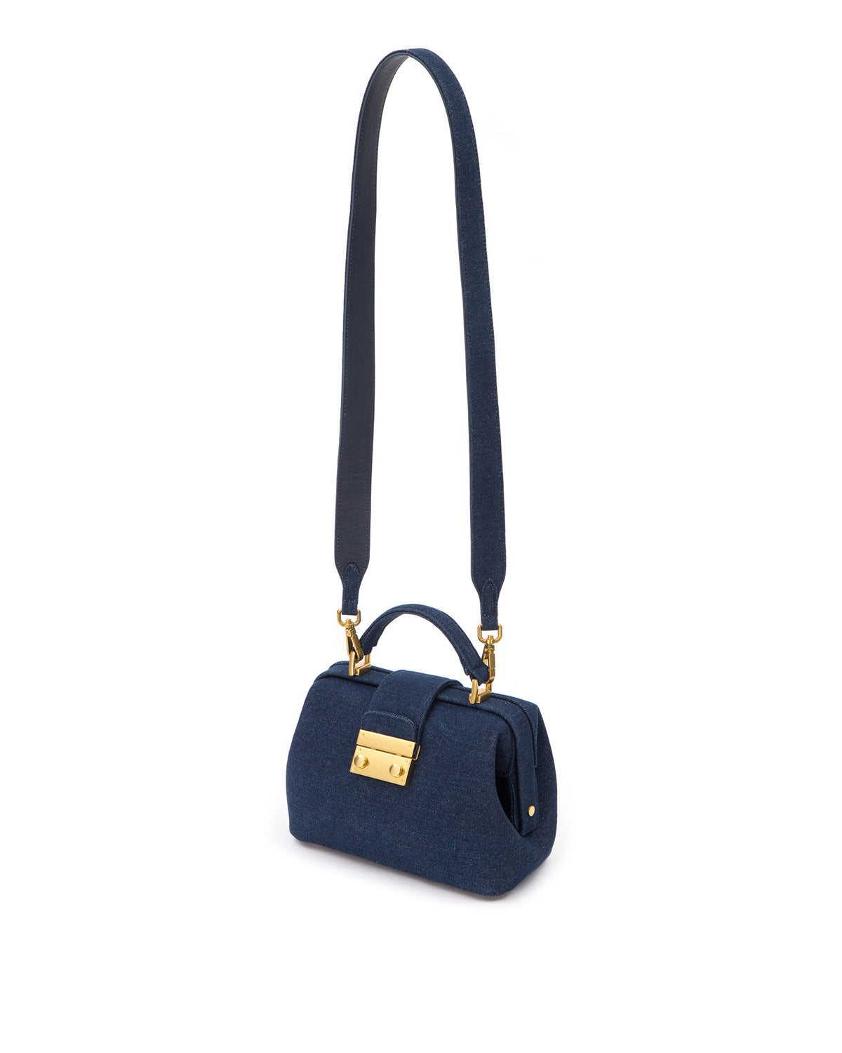 Elizabeth Doctor Bag in dark denim with dark denim handle brass clasp buckle, hanging from cross body strap