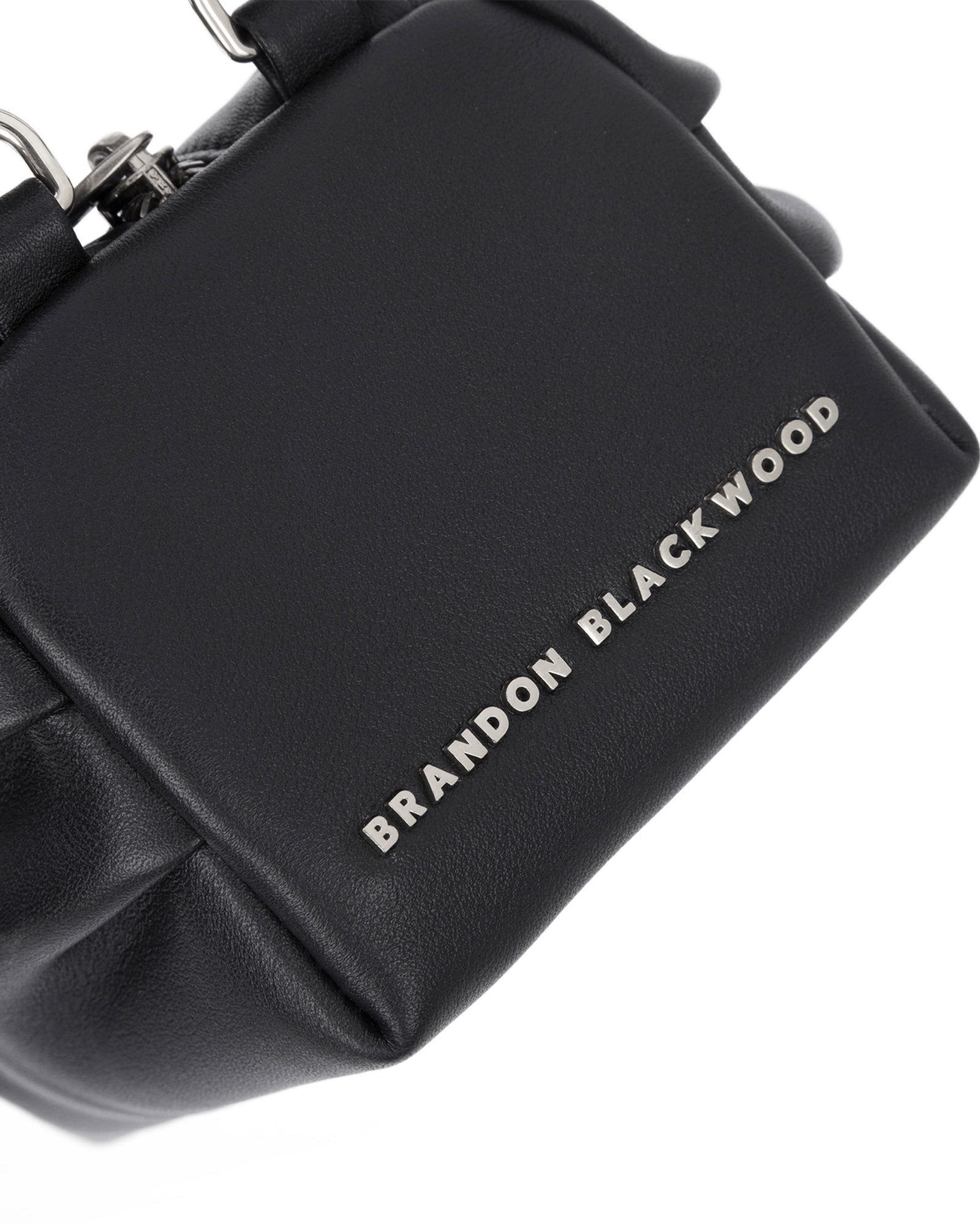 Angled close up of Mini Valentina with black smooth leather 
