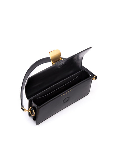 Angled over head view of wide open Nia Bag with black leather and black leather handle with brass logo magnetic closure thumbnail 4