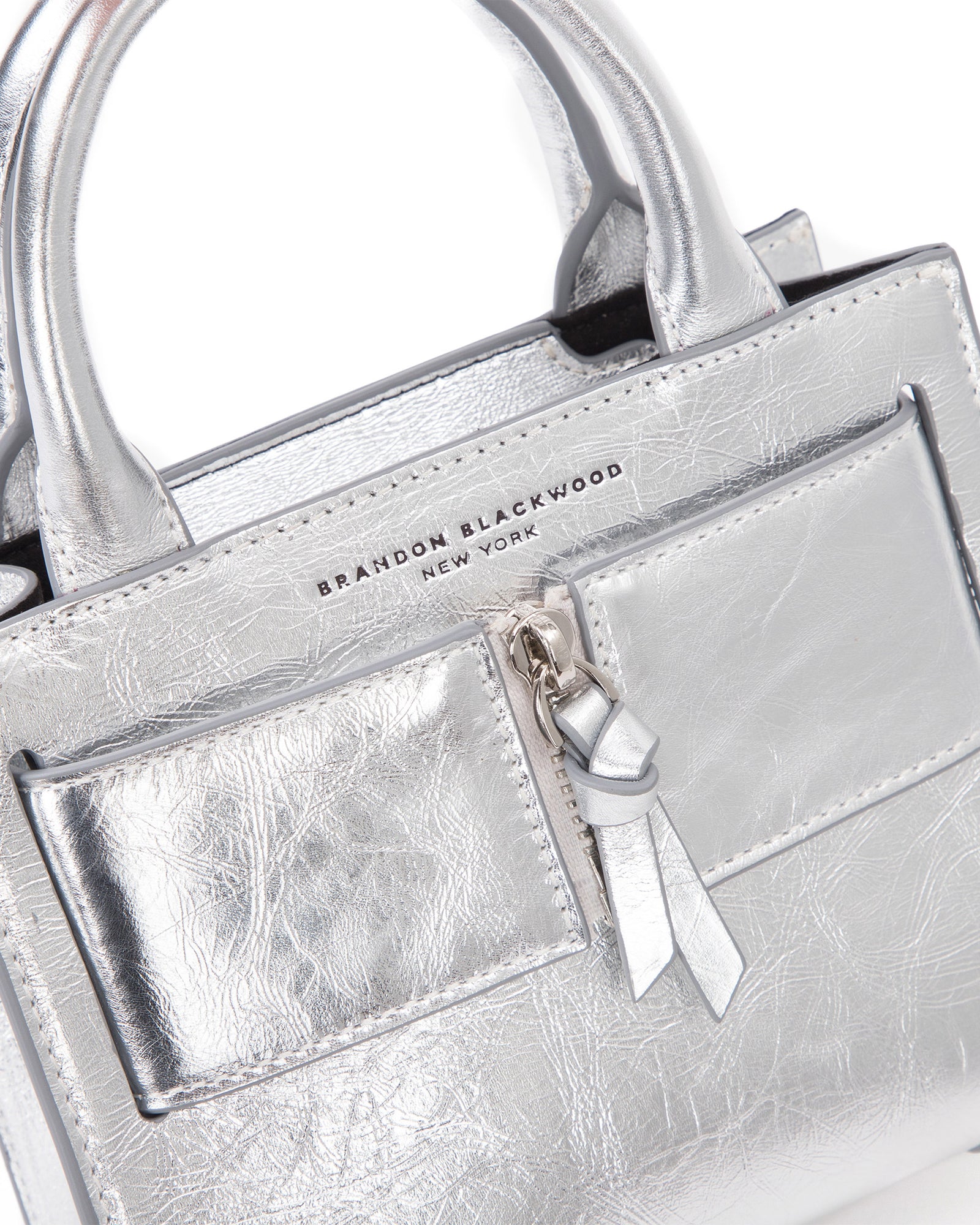 Angled close up of Kuei Bag in silver crinkle leather 