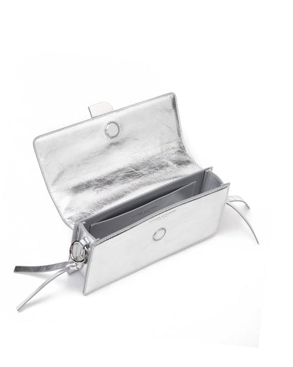 Angled over head view of wide open Nia Bag silver cracked leather and silver cracked leather strap with silver logo magnetic closure thumbnail 4
