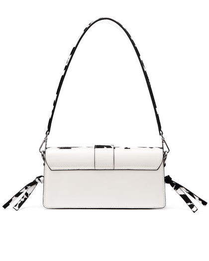 Back of Nia Bag with  black and white cow print thumbnail 5