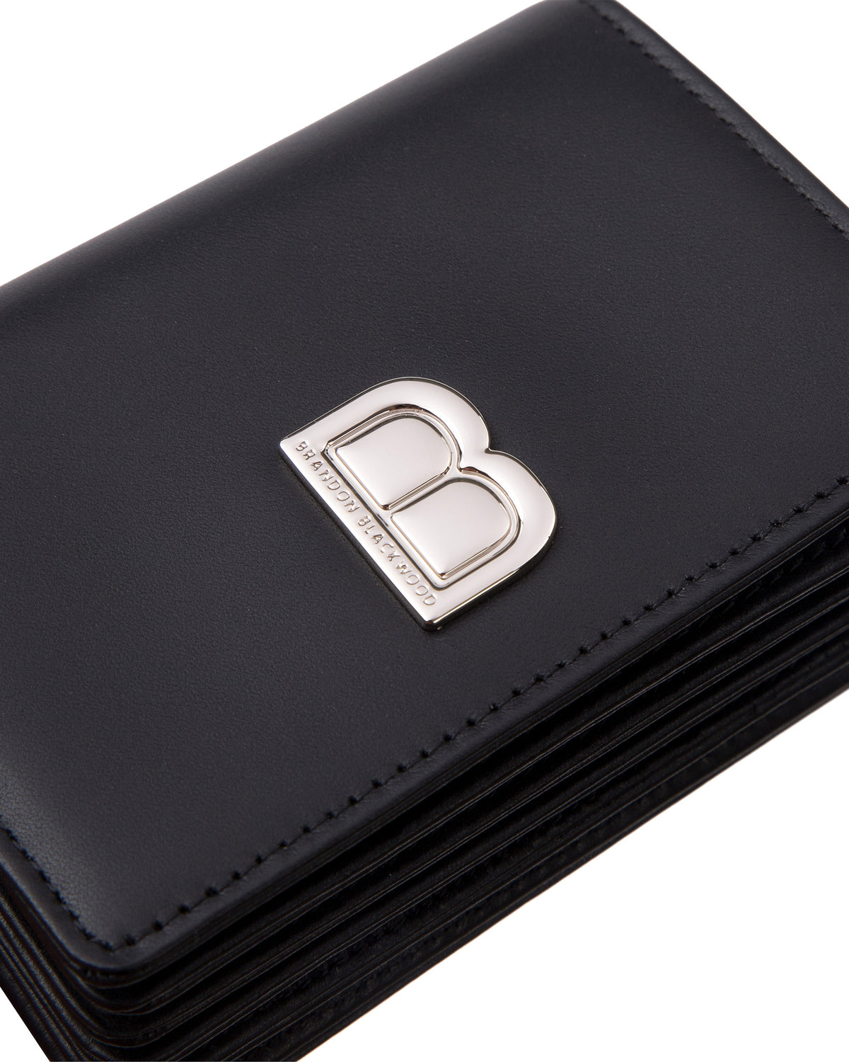 Angled close up of Accordion Card case, black leather body, silver Brandon Blackwood buckle, wristlet