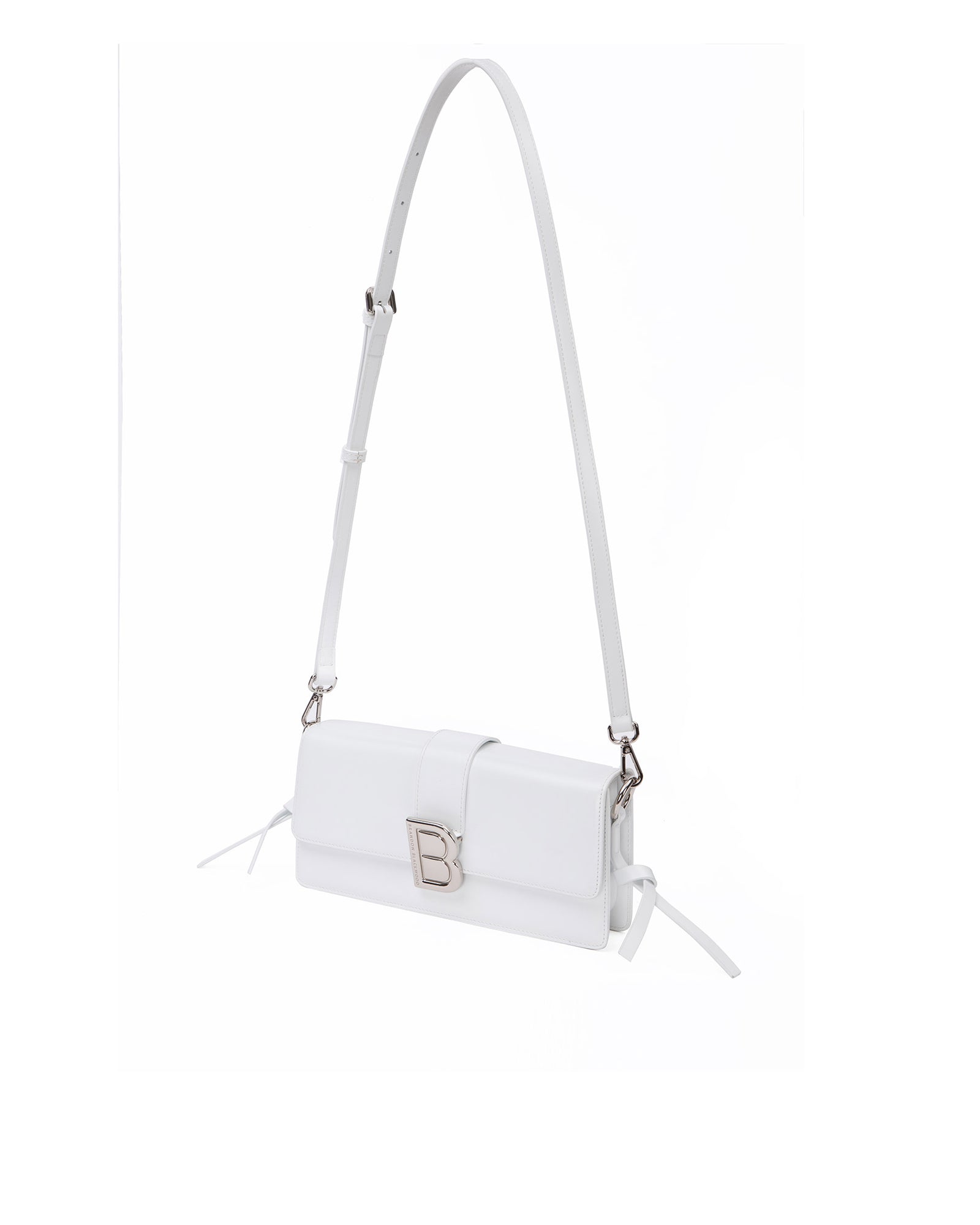 Nia Bag with white hard leather with white leather strap with silver logo magnetic closure hanging from strap