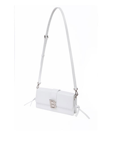 Nia Bag with white hard leather with white leather strap with silver logo magnetic closure hanging from strap thumbnail 8