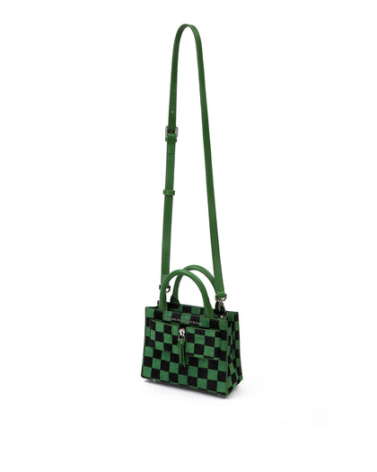 Angled over head view of wide open Kuei Bag in black and green checkered ponyhair with ponyhair handle ponyhair silver zipper hanging from strap thumbnail 5