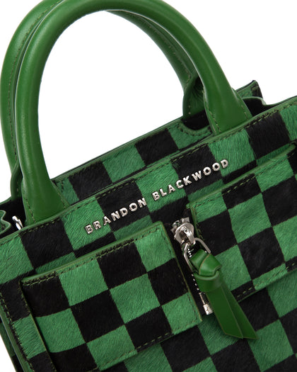Angled close up of Kuei Bag in black and green checkered ponyhair thumbnail 3