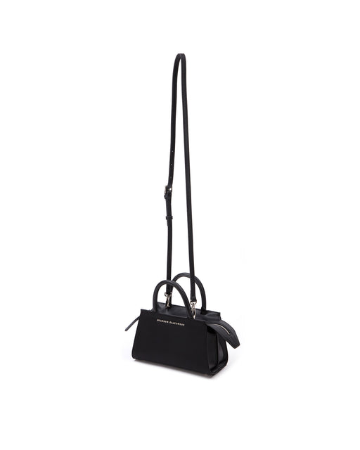 Front of Arlen Bag, black nylon body with leather handle, exaggerated zipper detail Arlen Bag, black nylon body with leather handle, Brandon Blackwood hardware logo, exaggerated zipper detail, hanging from cross body strap