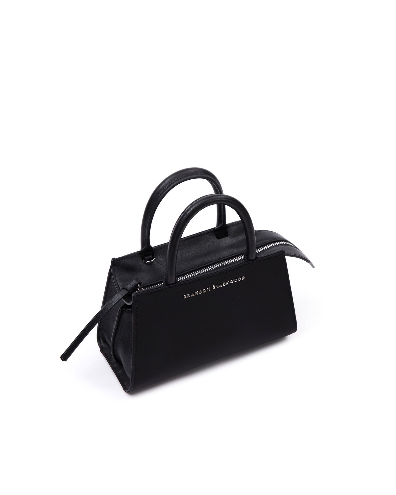 Angled close up of Arlen Bag, black nylon body with leather handle, Brandon Blackwood hardware logo