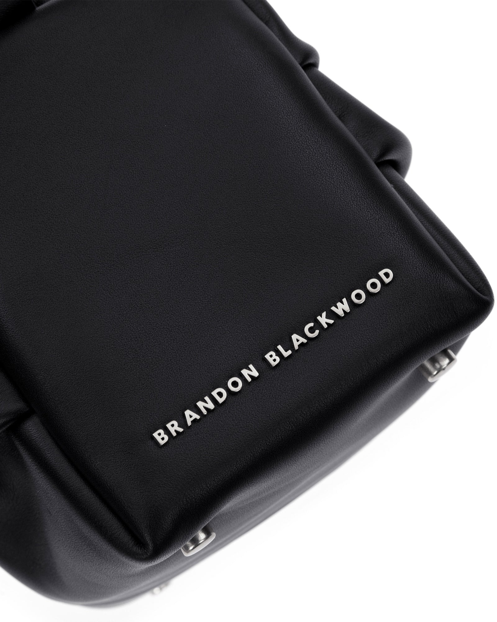 Angled close up  of Valentina Shoulder Bag in Black Smooth Leather with Silver Handle