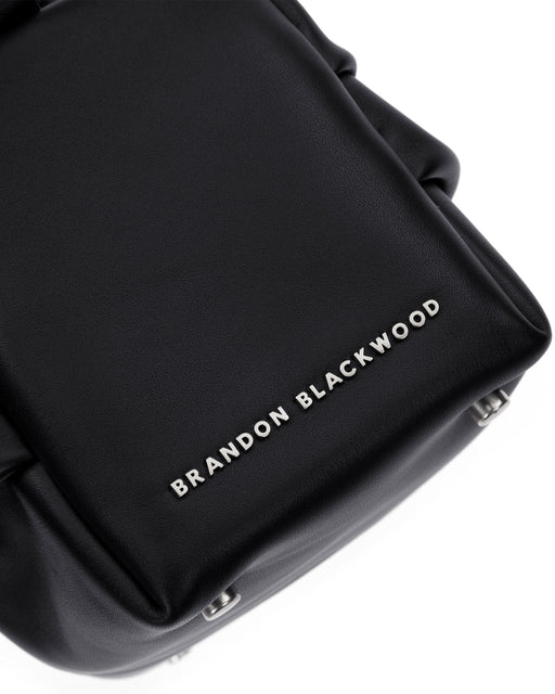 Angled close up  of Valentina Shoulder Bag in Black Smooth Leather with Silver Handle
