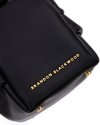 Angled close up of Valentina Shoulder Bag in Black Smooth Leather with Brass Chain Handle thumbnail 3