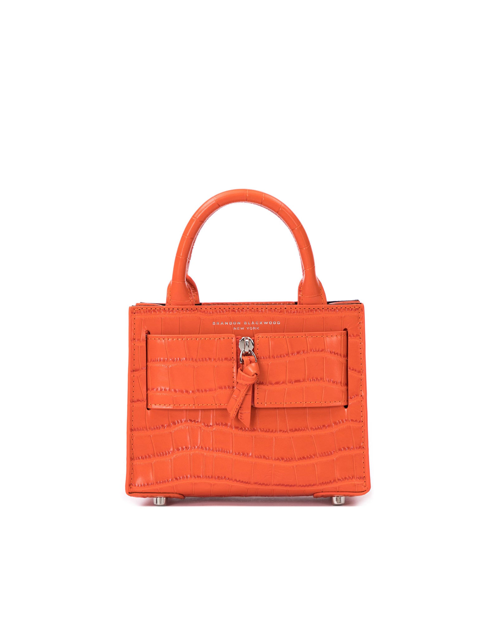 Front of Kuei Bag in orange croc embossed leather with orange croc embossed silver zipper 