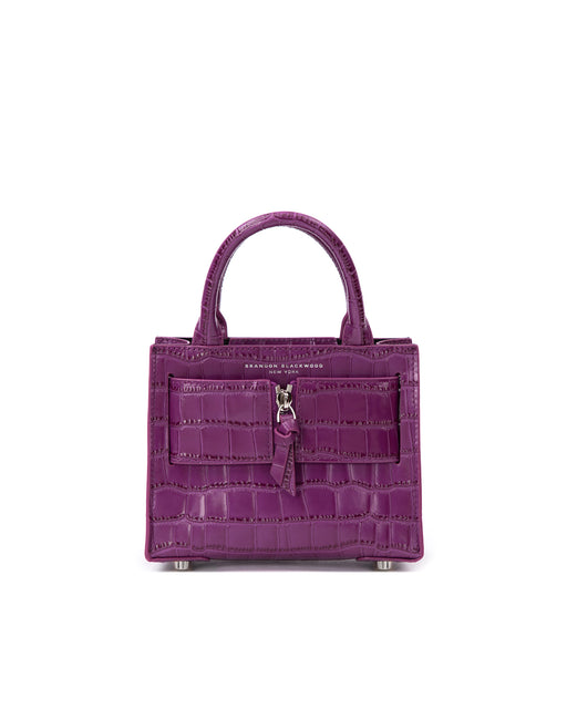 Front of Kuei Bag in purple croc embossed leather with purple croc embossed silver zipper 