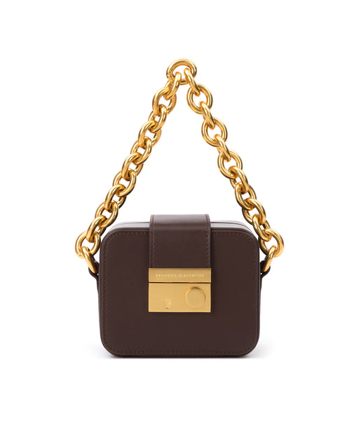 Front of Caro Buckle Bag in dark brown leather with brass chunky chain handle and brass clasp buckle 