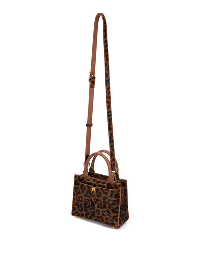 Angled over head view of wide open Kuei Bag in brown and black leopard print ponyhair  with ponyhair handle ponyhair brass zipper hanging from strap thumbnail 5