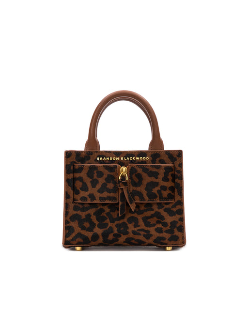 Front of Kuei Bag in brown and black leopard print ponyhair with ponyhair brass zipper 