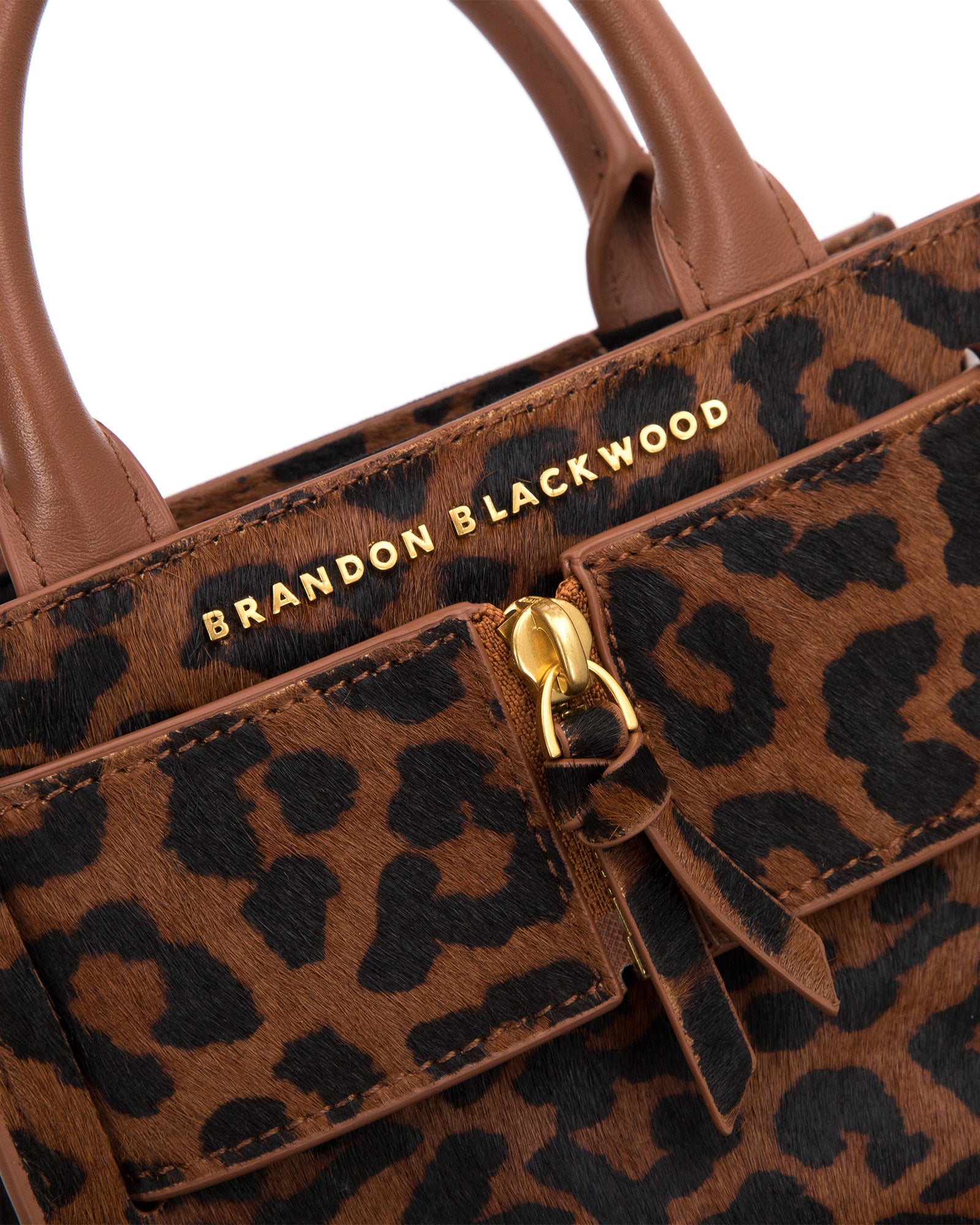 Angled close up of Kuei Bag in brown and black leopard print ponyhair  