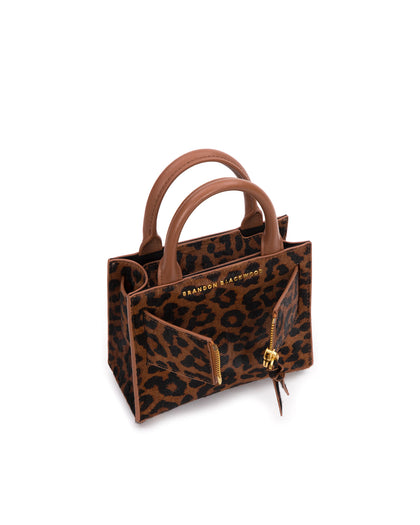 Angled over head view of wide open Kuei Bag in brown and black leopard print ponyhair  with ponyhair handle ponyhair brass zipper  thumbnail 4