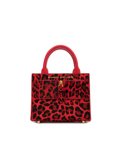 Front of Kuei Bag in red and black leopard print ponyhair with ponyhair brass zipper 