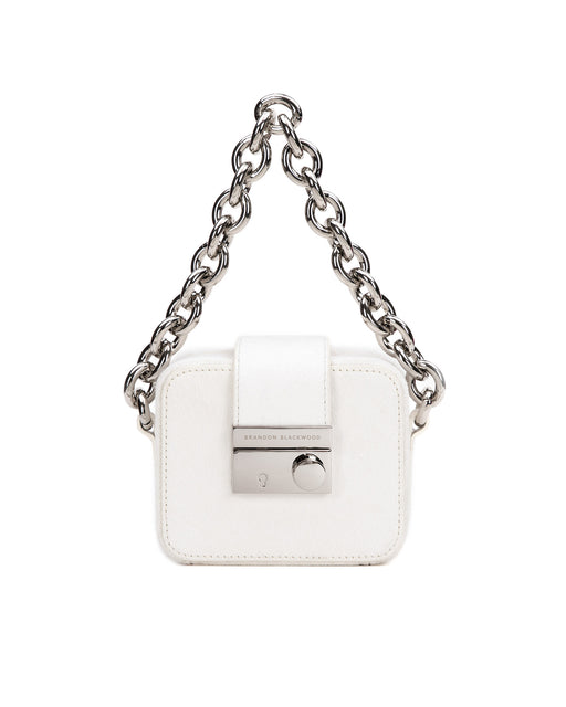 Front of Caro Buckle Bag in white ponyhair with silver chunky chain handle and silver clasp buckle 