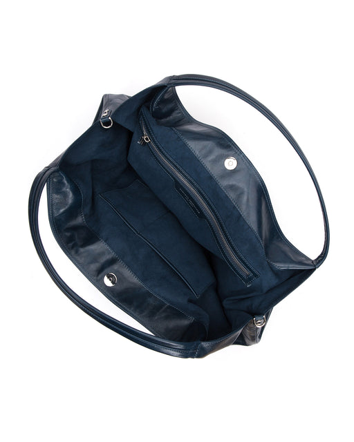 Angled over head view Hobo Tote Bag in Blue Cracked Leather with Silver Hardware wide open with magnetic closure 