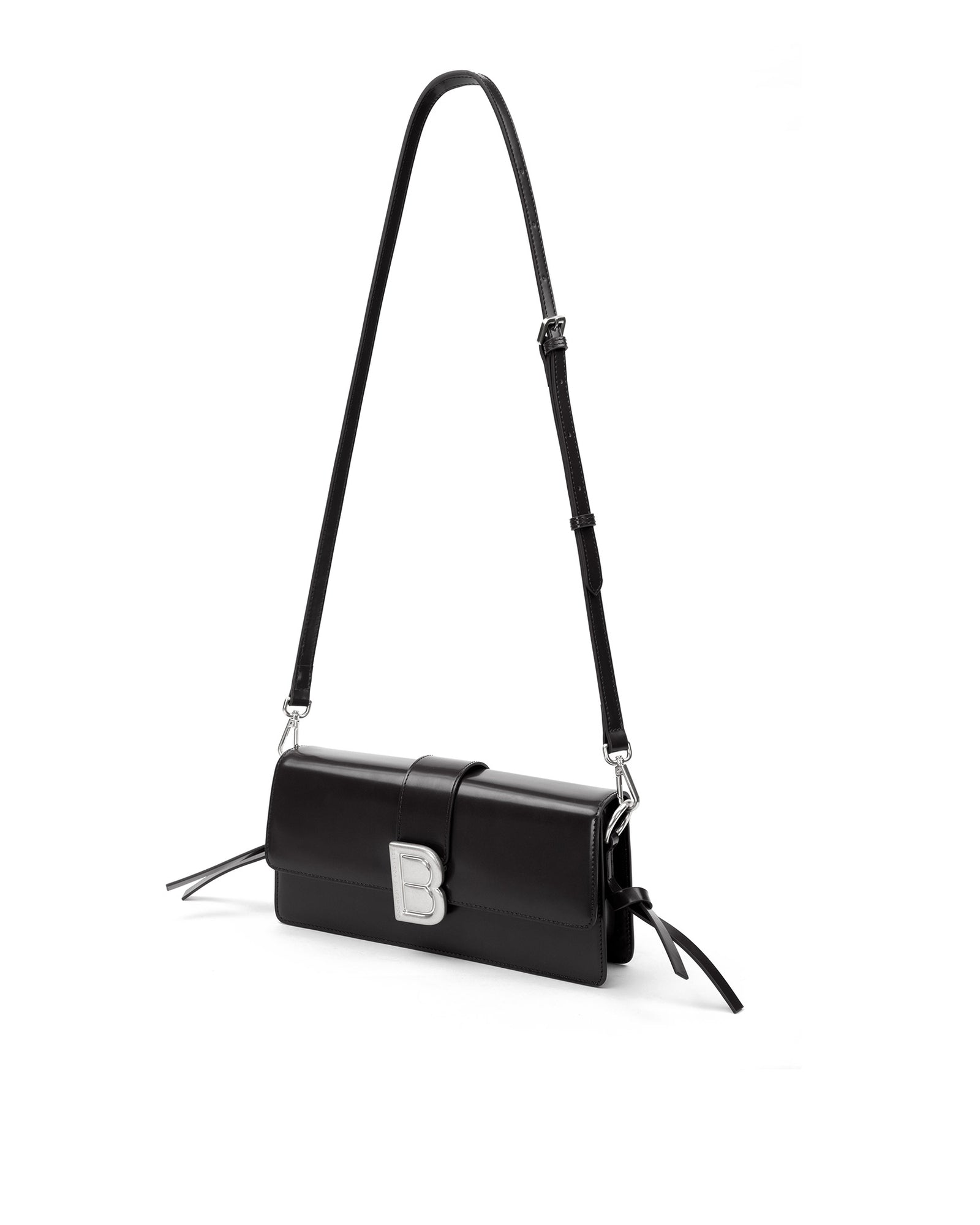 Nia Bag with black hard leather with black leather strap with silver logo magnetic closure hanging from strap