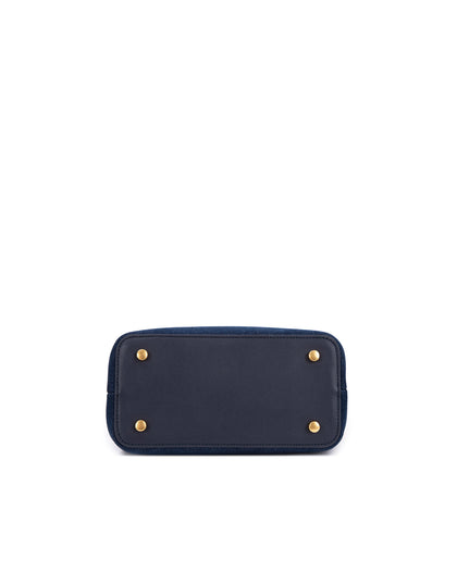 Bottom of Elizabeth Doctor Bag in dark denim four metal feet thumbnail 7