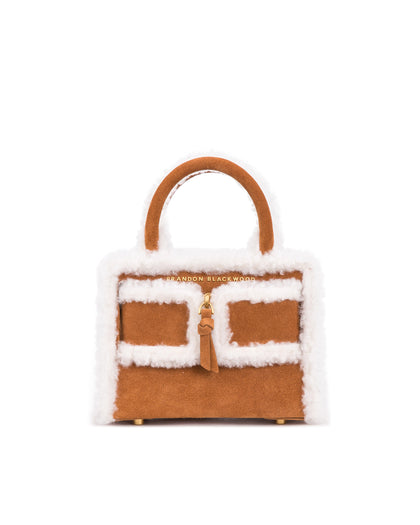 Front of Kuei Bag in tan suede with shearling edges with suede zipper  thumbnail 1
