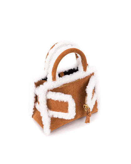 Angled over head view of wide open Kuei Bag intan suede with shearling edges with tan suede and shearling edges handle zipper  thumbnail 4
