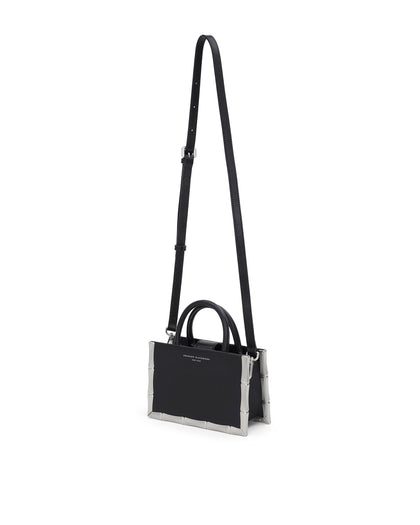 Bamboo B Tote, in black leather with leather handle and silver bamboo embossed trim, hanging from cross body strap thumbnail 7