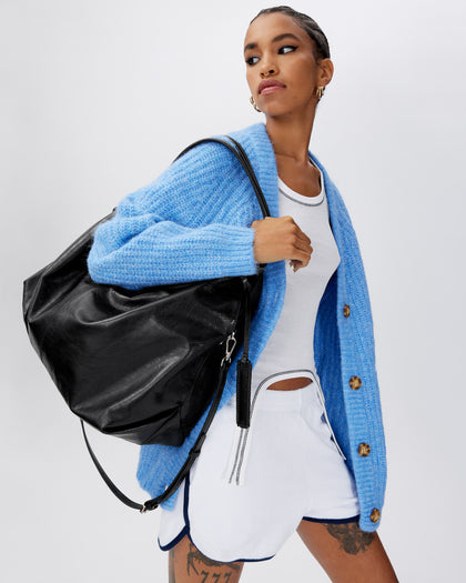 Model posing with Hobo Tote Bag in Black Cracked Leather with Silver Hardware thumbnail 2